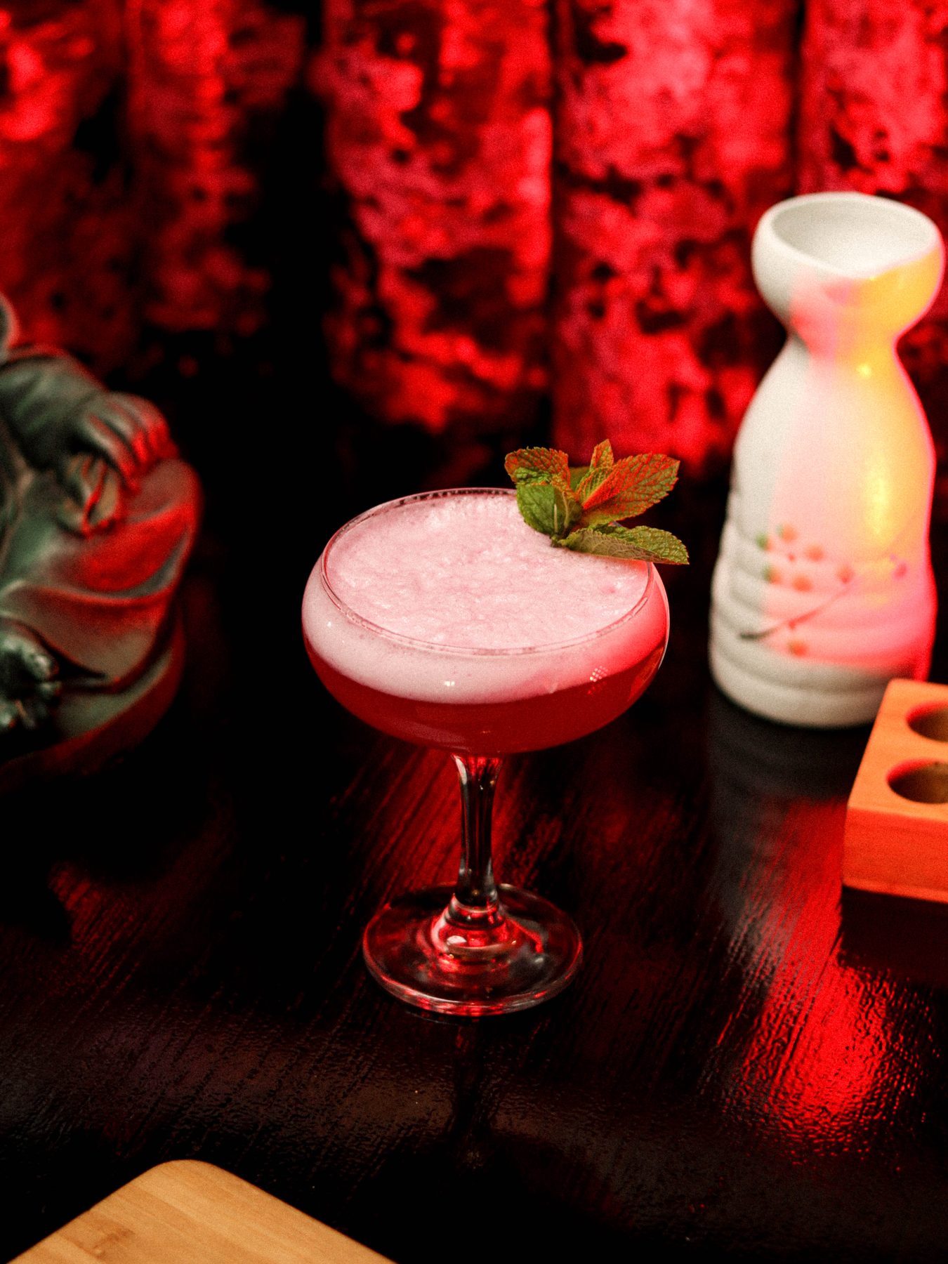 Tea-infused cocktail in a mint coupe at Chunky Chau bar