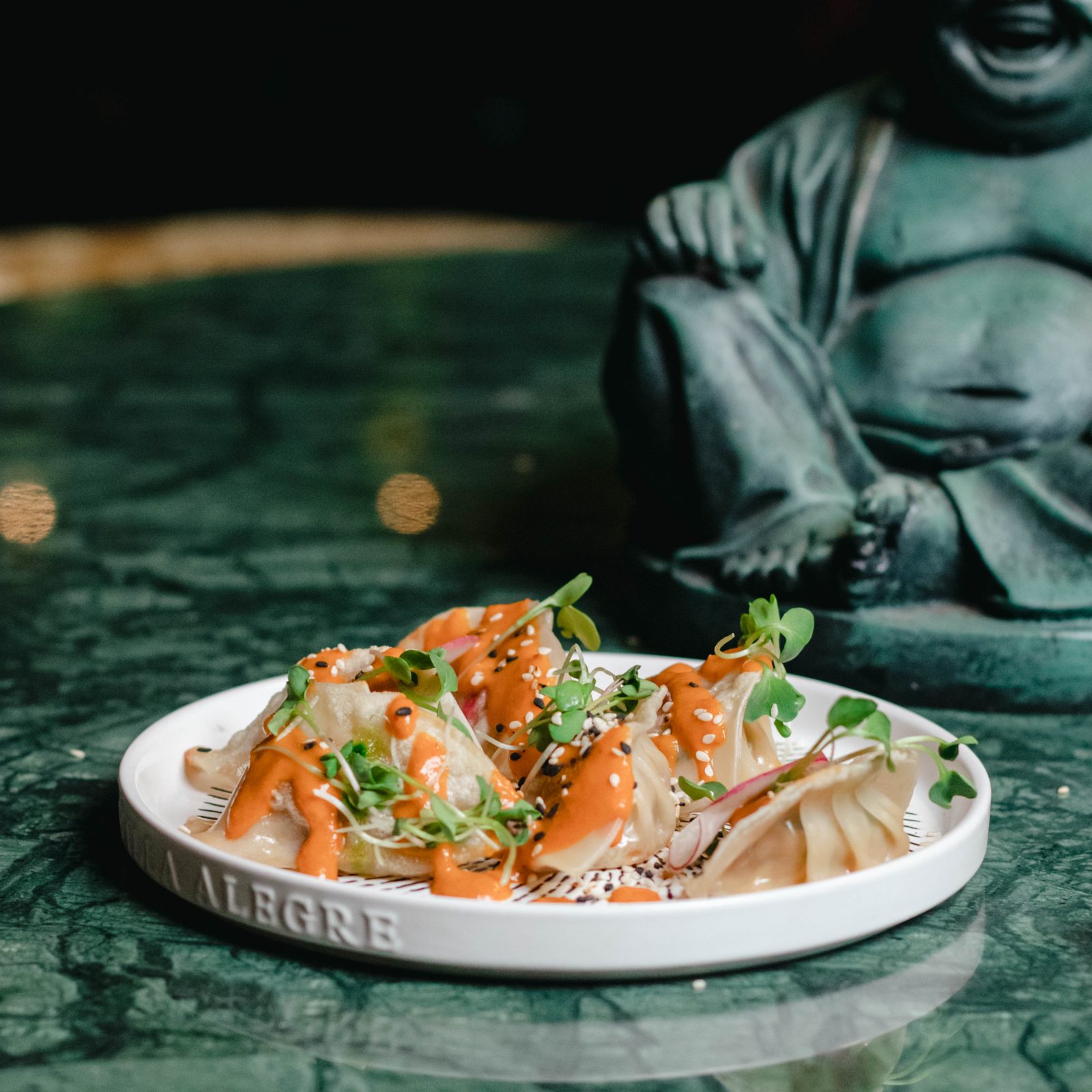 Chunky Chau Sandton — Signature sushi under the Buddha